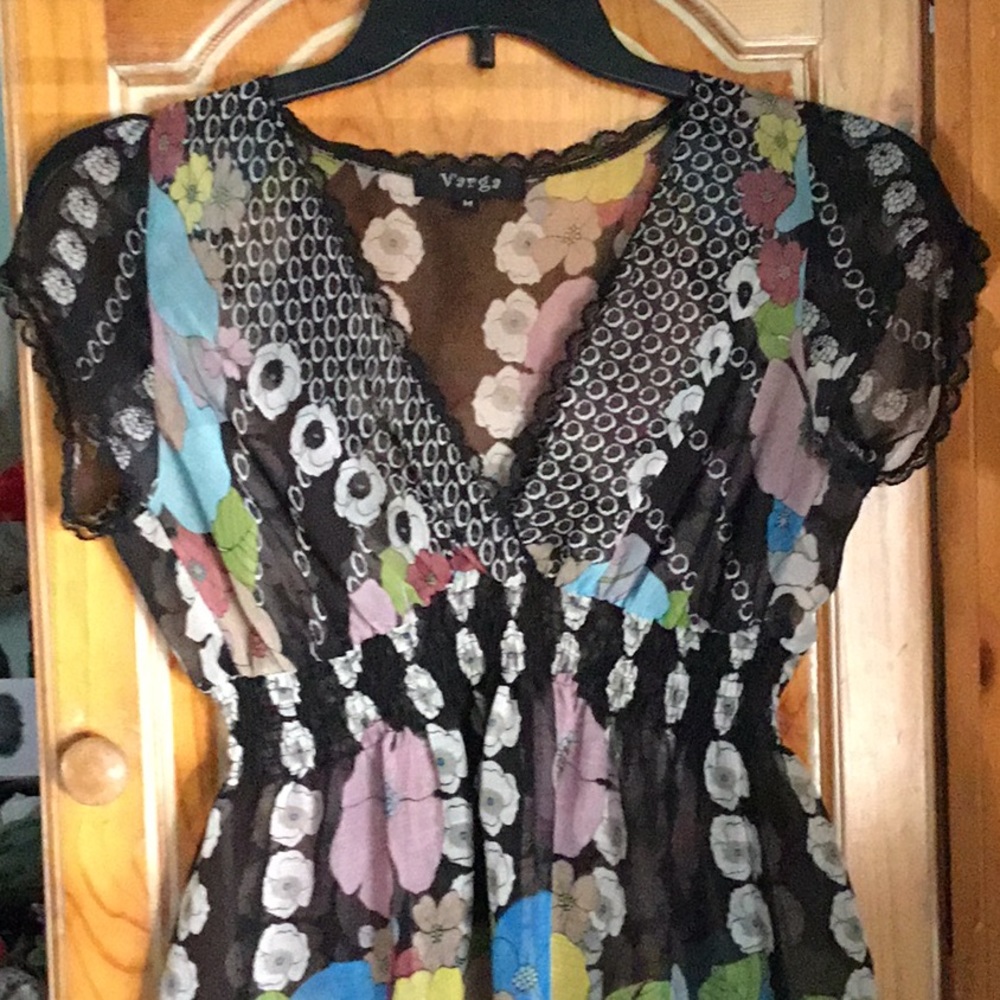 Sheer top but can be worn as a dress. Like new.